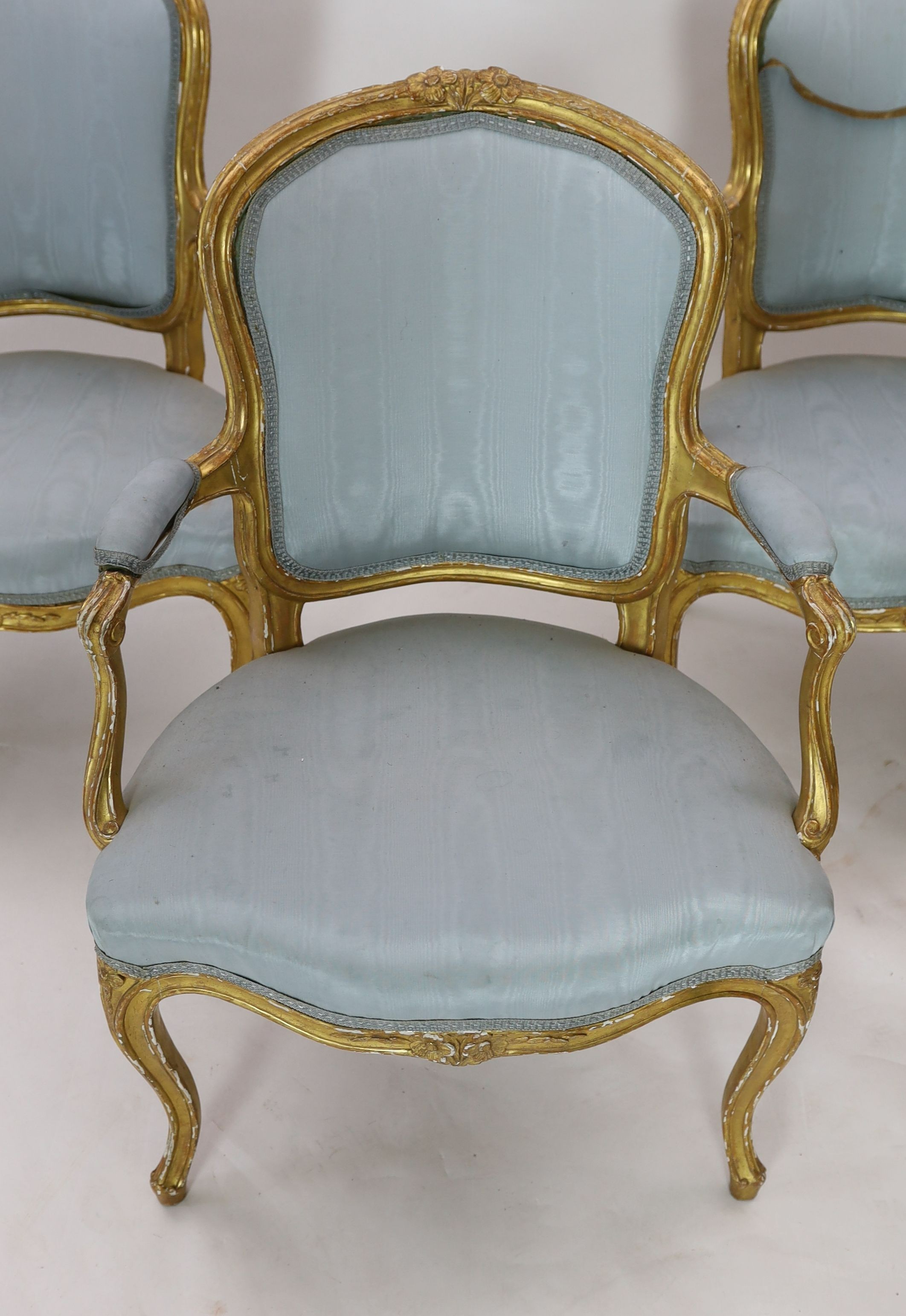 A set of four Louis XVI carved giltwood fauteuils, W.65cm D.62cm H.93cm